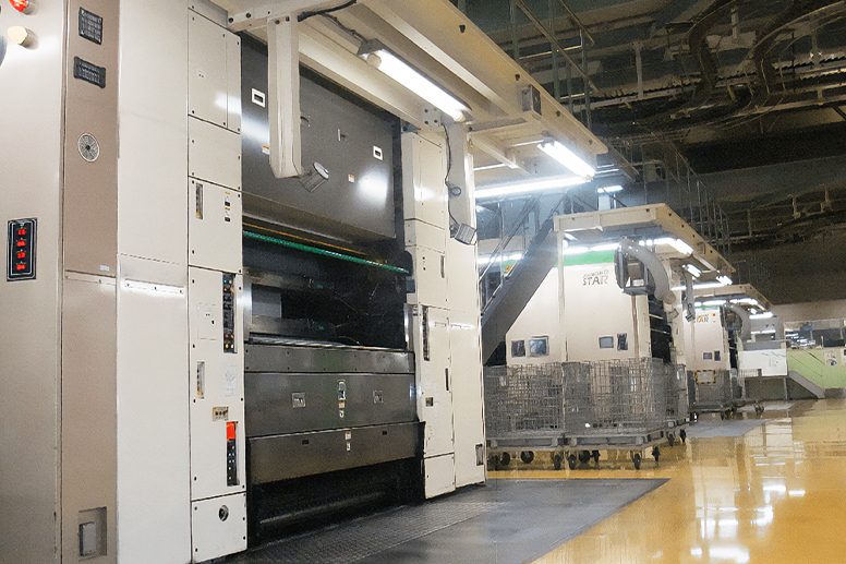 Inside a factory lined with newspaper printing presses