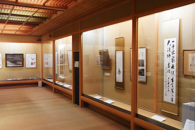 An exhibition room displaying calligraphy and archival materials