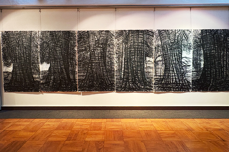 A large painting depicting a grove of trees