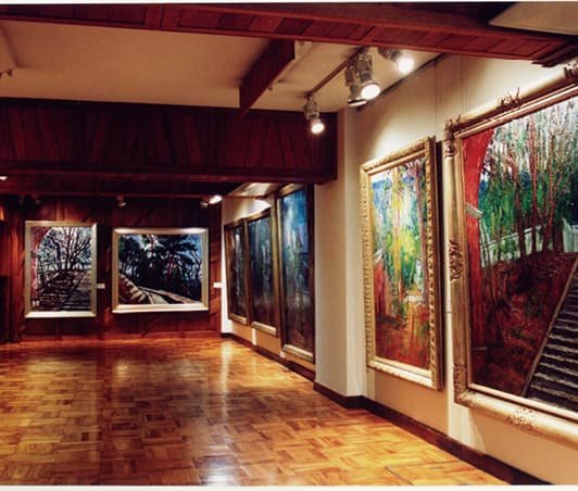 An exhibition room displaying paintings