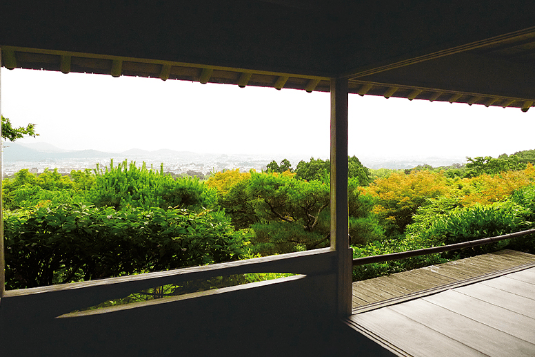 A garden and the city of Kyoto viewed from the engawa veranda