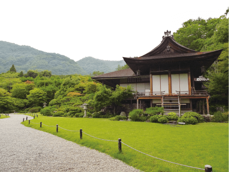 A garden building standing beyond a lawn