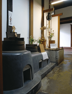The interior lined with kamado cooking stoves