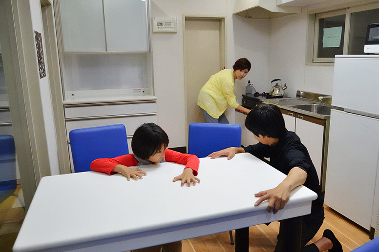 A parent and child experiencing an earthquake simulator