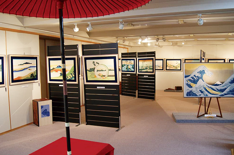 An exhibition room displaying shibori tie-dye works