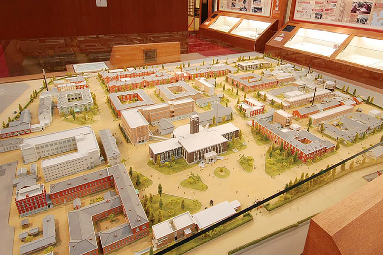 An exhibition room featuring a campus model