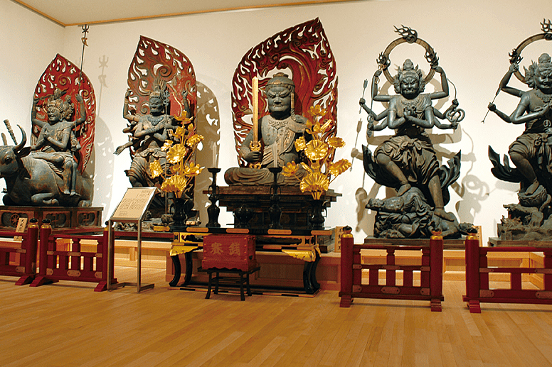 An exhibition room displaying Buddhist statues