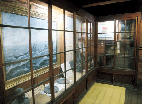 An exhibit viewed through a glass case