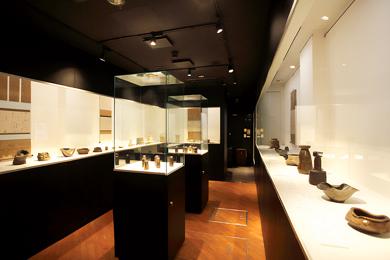 An exhibition room lined with display cases