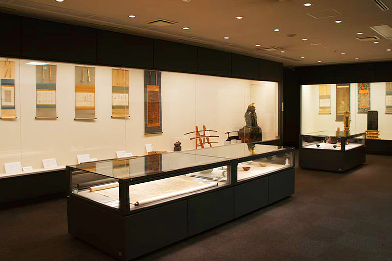 An exhibition room lined with display cases