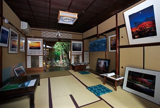 A Japanese-style room displaying photographic works