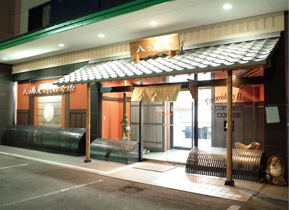 The entrance to a building with a noren curtain
