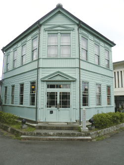 The exterior of a pale blue Western-style house