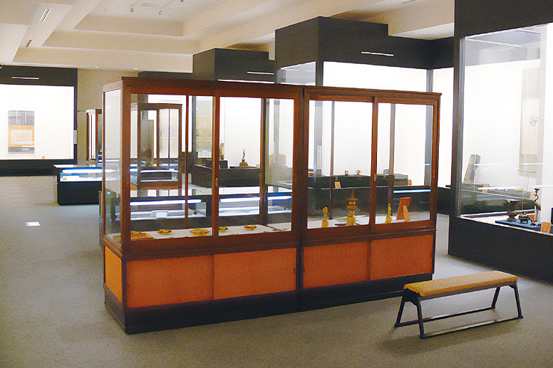 An exhibition room lined with display cases