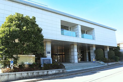 The exterior of a white building with steps